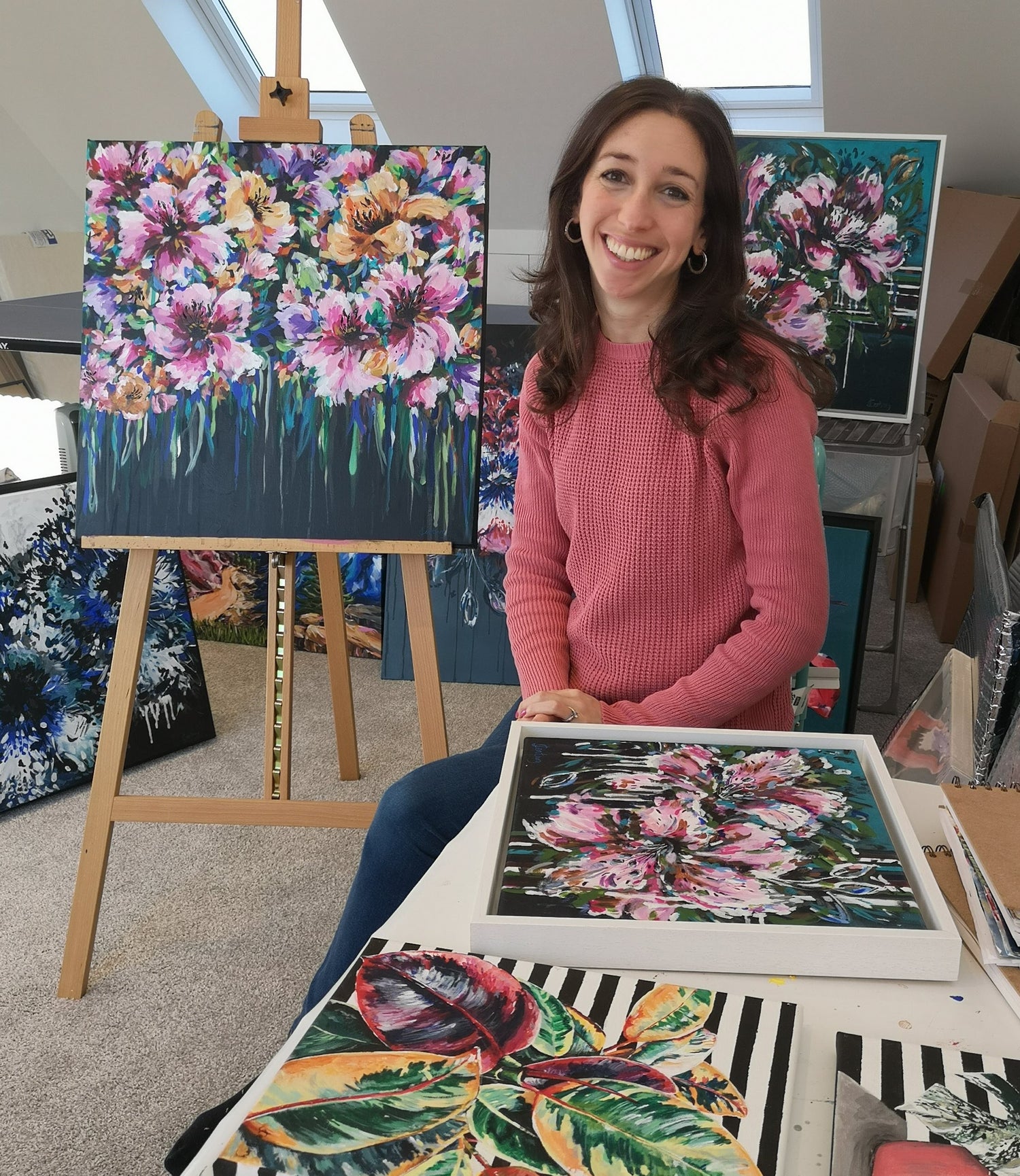 Judy Century Artist in Studio with Colourful Abstract Original floral paintings