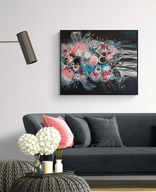 Colourful Original Abstract Floral Painting and Art print by Judy Century Art. Black, Pink Blue, white contemporary statement home decor. Shown on a white wall above slate grey sofa with pink cushions and decorative accessories