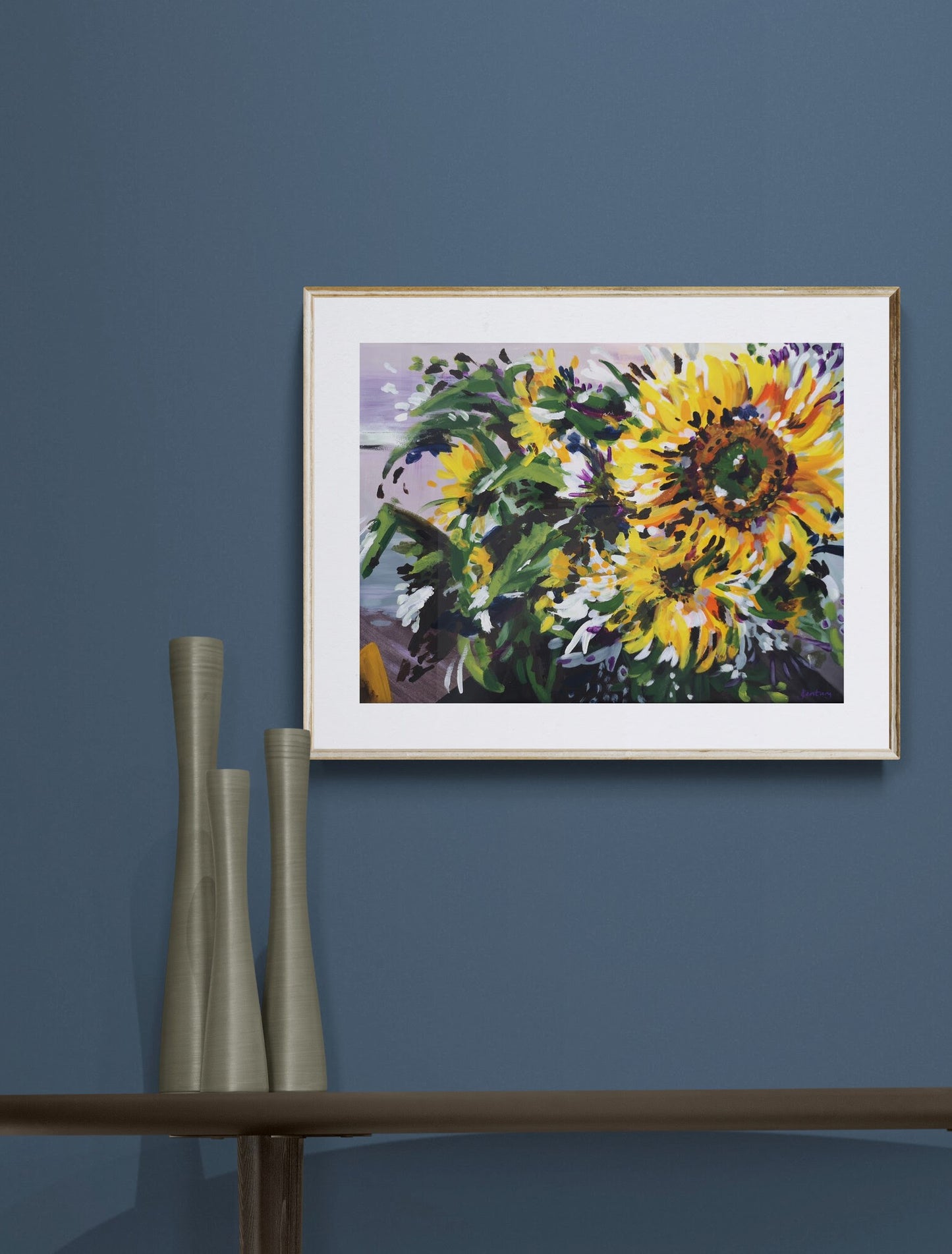 Expressive Sunflower acrylic painting on paper by Judy Century. Yellow, Green and purple wall art. shown on a navy wall above wooden sideboard.
