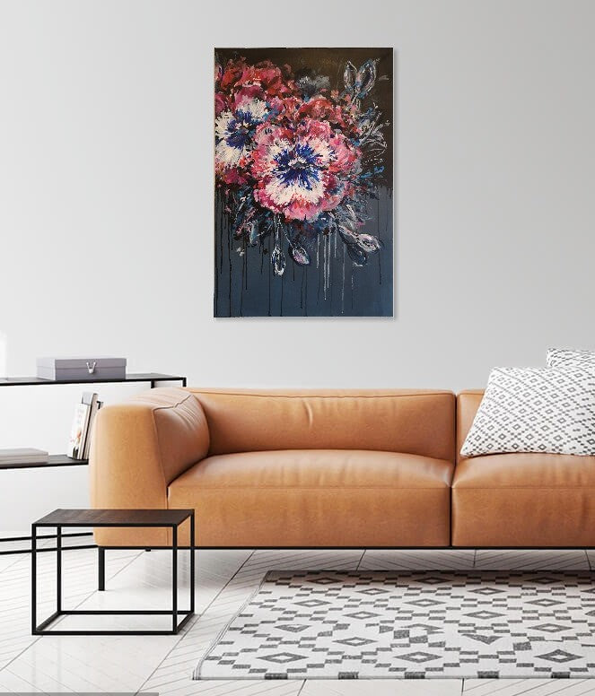 Contemporary Abstract Floral Pansy painting on dark background by Judy Century Art hanging above a tan leather couch