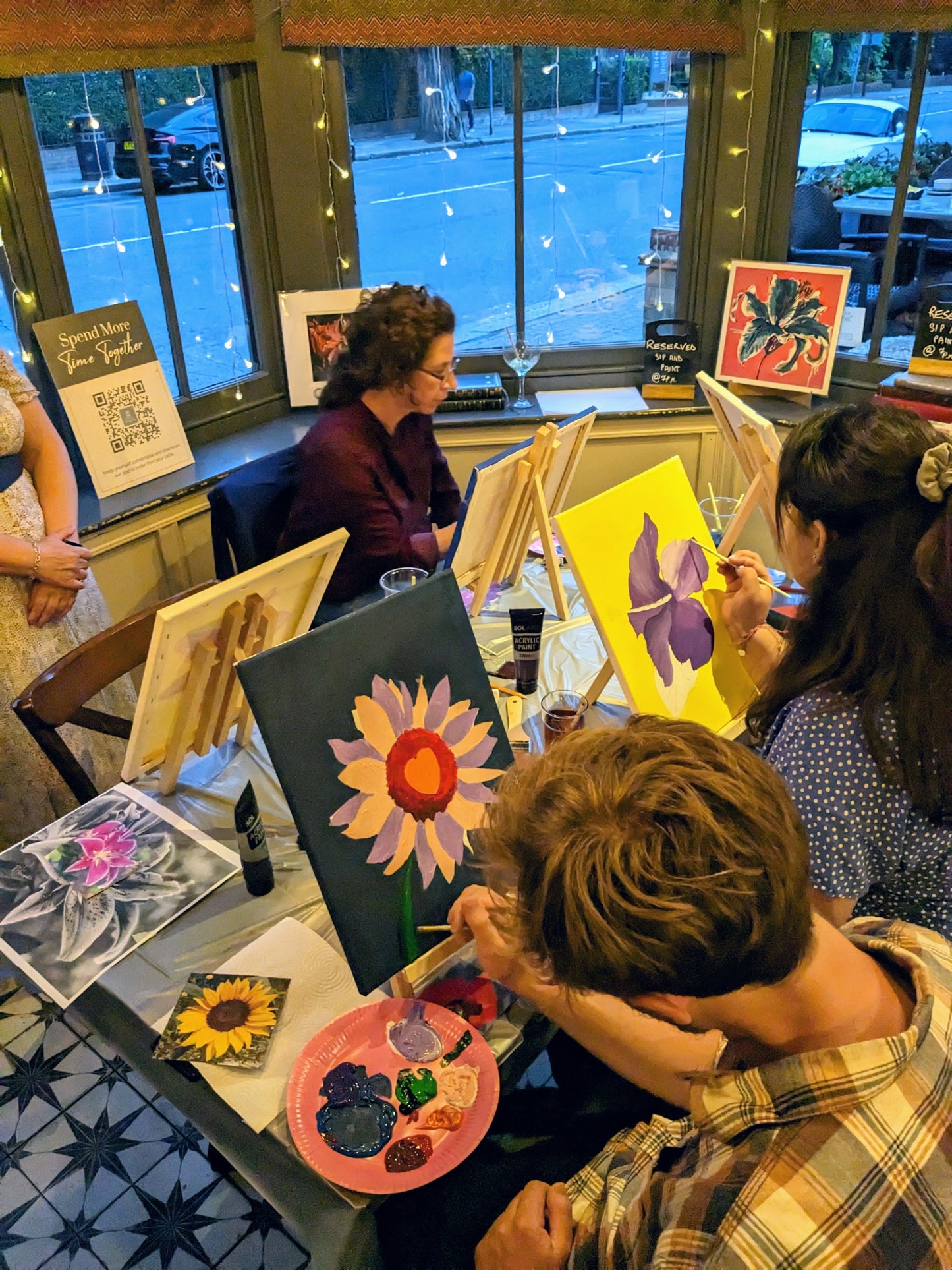 Participants at a floral painting class workshop in London pub with Judy Century Art