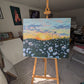 Large daisy sunset landscape painting in Judy Century Art Studio, fresh on the easel