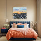 Large floral landscape painting in modern bedroom with wild daisies and sunset sky. By London artist Judy Century Art.