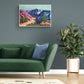 Vibrant, colourful Abstract Landscape painting by Judy Century. Mountain adventure acrylic canvas wall art hanging on blue grey wall in room with green sofa and large plant