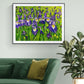 Iris landscape acrylic painting in expressive style. Bold purple, yellow, white, green with leaves and flowers. Framed in black by Judy Century Art. Shown hanging on white wall above green sofa. 