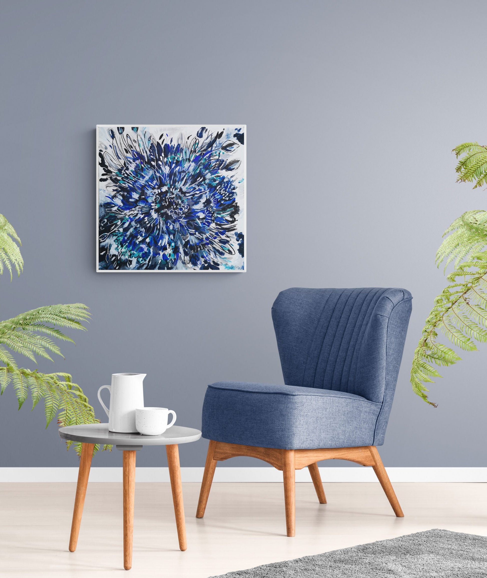 Interior Decor inspiration Judy Century Blue Cornflower Burst canvas painting hanging in situ against blue wall with blue armchair