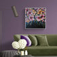 Colourful Floral Canvas painting of abstract flower bouquet by Judy Century. Shown hanging on warm purple wall above olive velvet sofa with home accessories