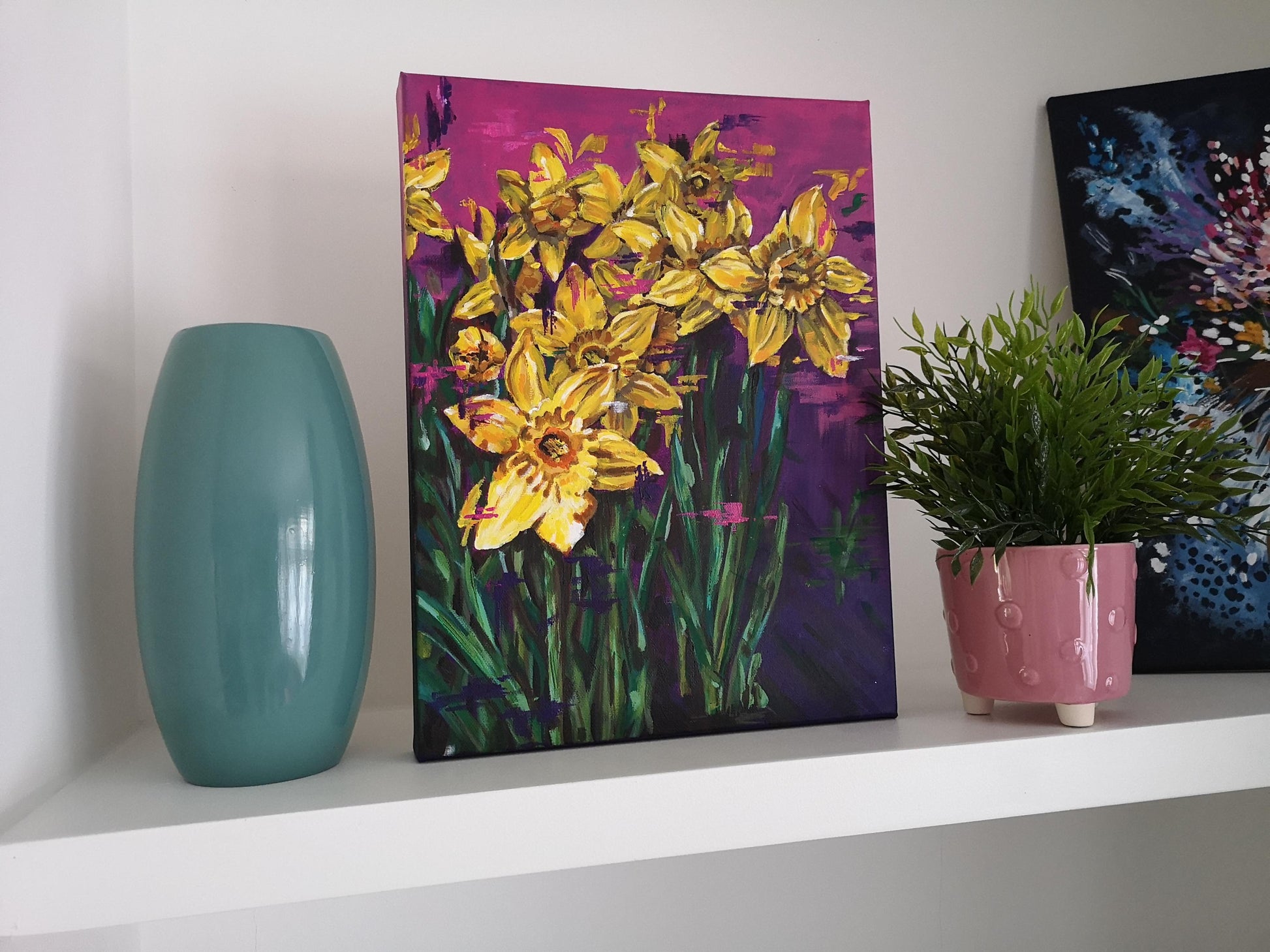 Contemporary vibrant daffodil painting by Judy Century Art. Interior Décor inspiration for shelves and gallery walls. Semi Abstract painting featuring colourful yellow, purples and pinks