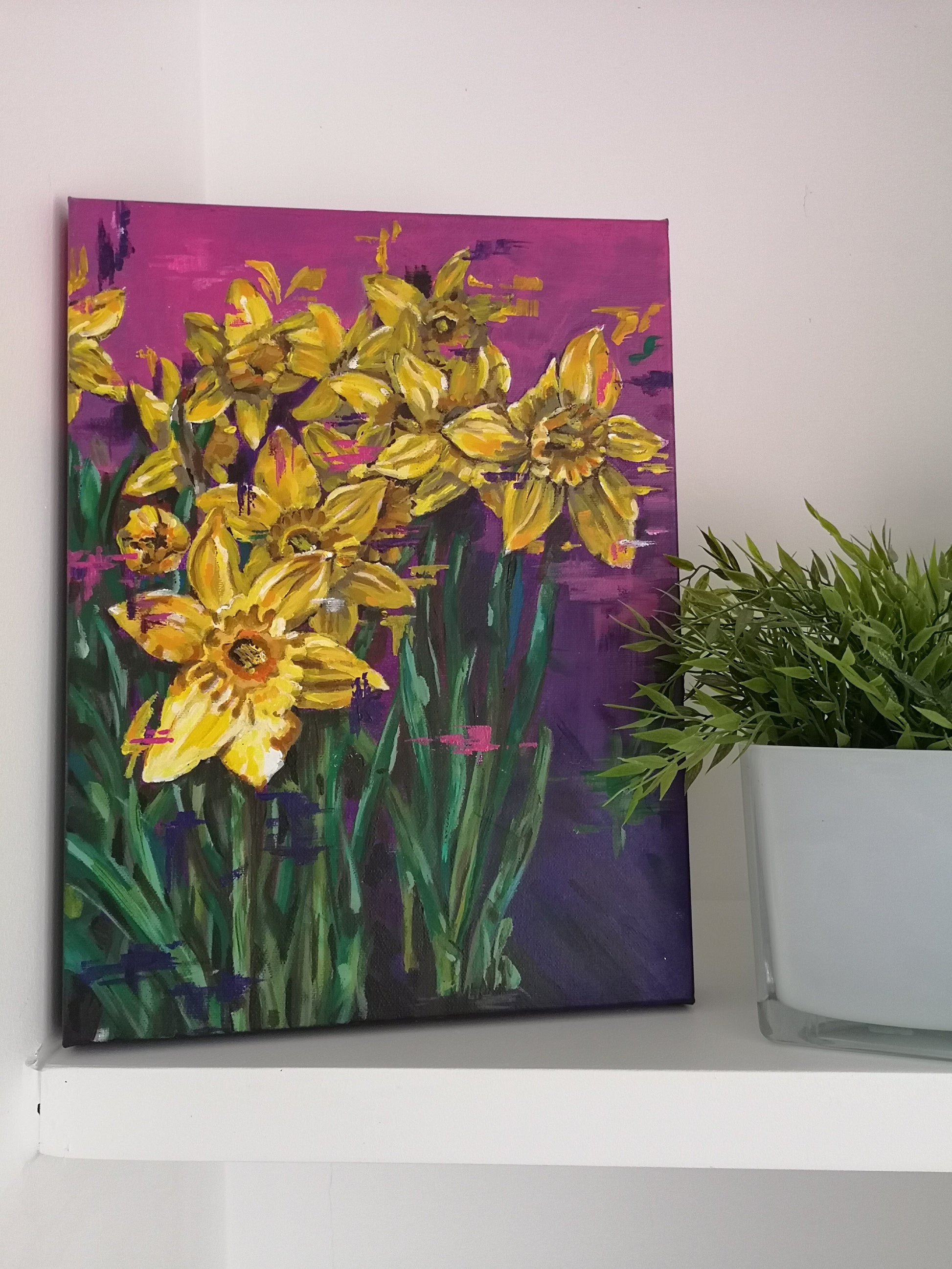 Contemporary vibrant daffodil painting by Judy Century Art. Interior Décor inspiration for shelves and gallery walls. Semi Abstract painting featuring colourful yellow, purples and pinks