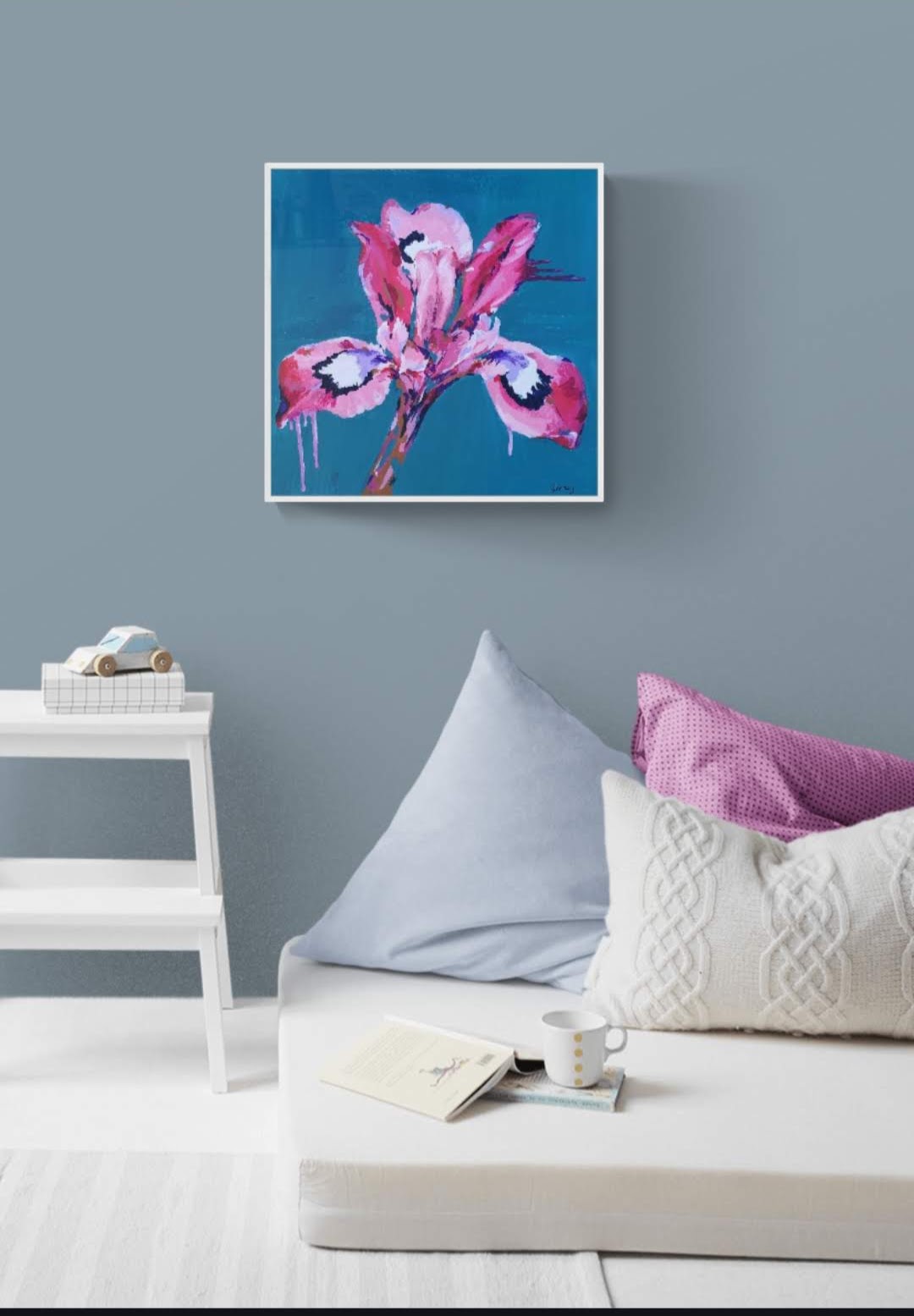 Bright Colourful Modern Iris flower canvas painting by Judy Century. Teal background with pink, white, purple and navy Lily. Original Art hanging in kids bedroom interior for home decor inspiration