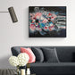 Colourful Original Abstract Floral Painting and Art print by Judy Century Art. Black, Pink Blue, white contemporary statement home decor. Shown on a white wall above slate grey sofa with pink cushions and decorative accessories