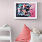 Original paper acrylic painting by Judy Century Art. Hibiscus Sorbet in black frame hanging on a navy wall above a wooden sideboard with plant in gold pot and wooden chair. Pinks, blues, teal, navy peach and white colours in elegant graphic interpetation. Shown framed in White