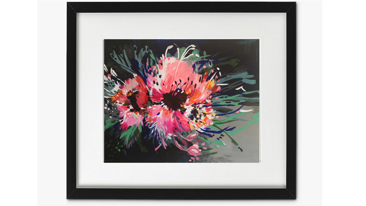 Art Print of Abstract Flower Painting featuring two large bold pink blooms bursting on the page, with contrasting lines of blue, green and white extending out to add movement. Vibrant, bold and colourful original painting by Judy Century. Framed in black frame with white mount.