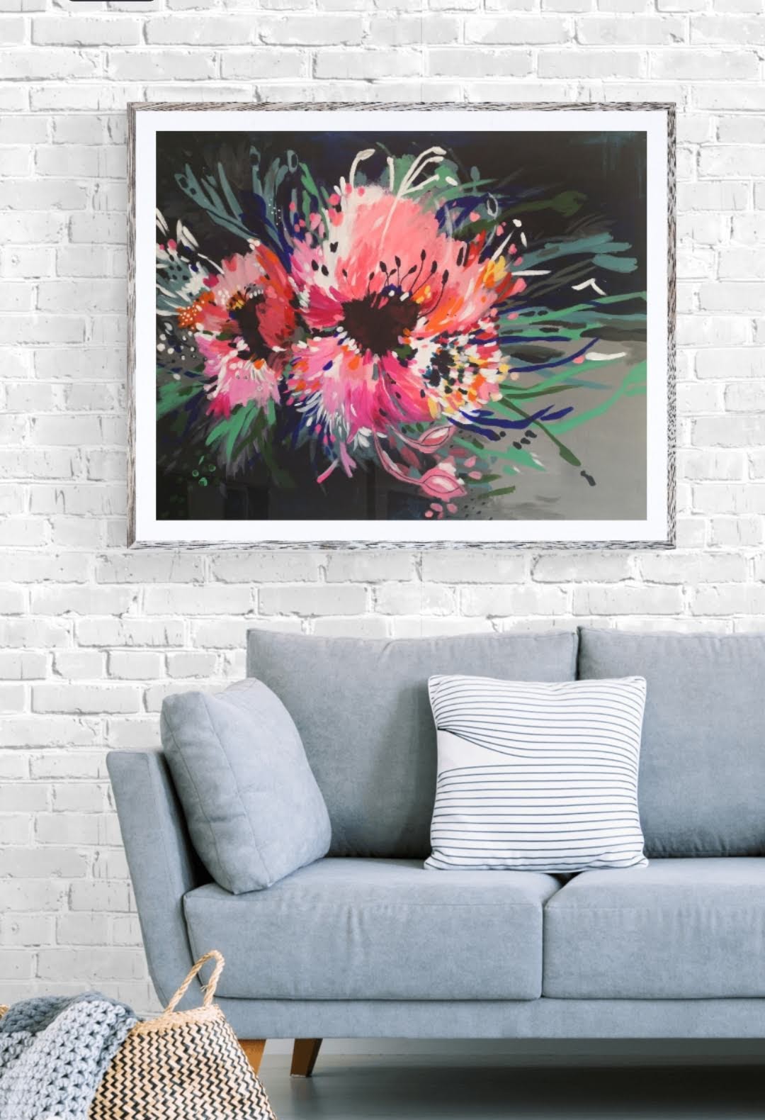 Art Print of Abstract Flower Painting on canvas, hanging on white brick wall above grey couch, by Judy Century.