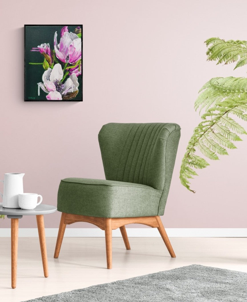 Interior styling modern sitting room with pale pink wall and green occasion chair with Modern botanical small canvas painting magnolia tree by Judy Century 