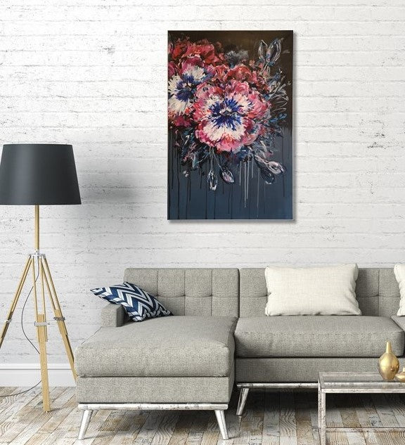 Contemporary Abstract Floral Pansy painting on dark background by Judy Century Art hanging on white brick wall above grey couch