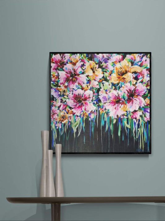Colourful Floral Canvas painting of abstract flower bouquet by Judy Century. Home decor ideas shown above wooden console table on teal duck egg blue wall with silver vase ornaments